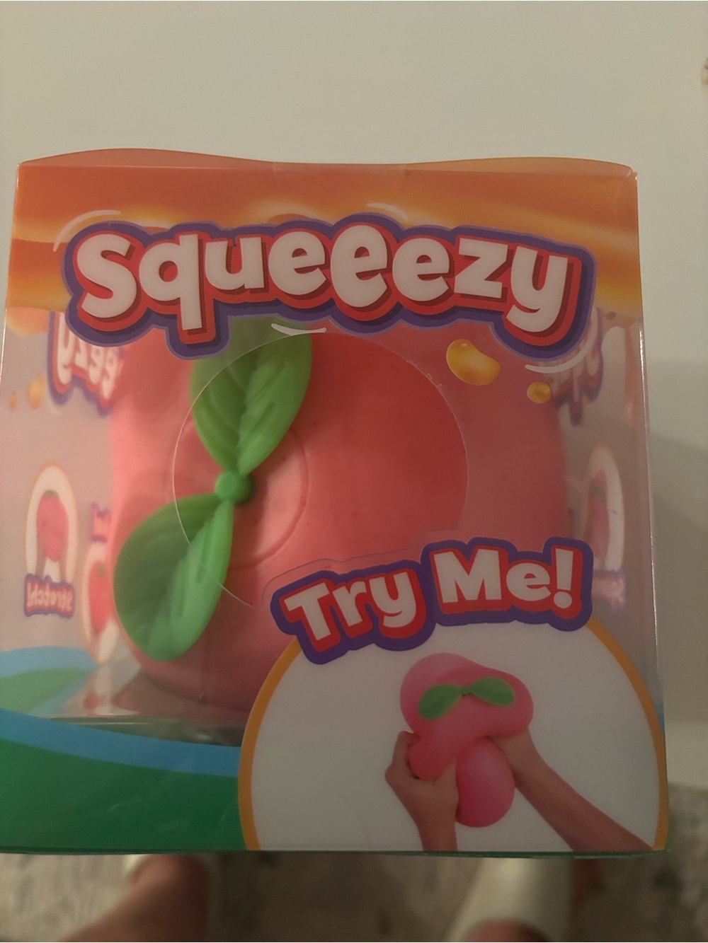 Peach Squishy Toy with Green Leaf Accent